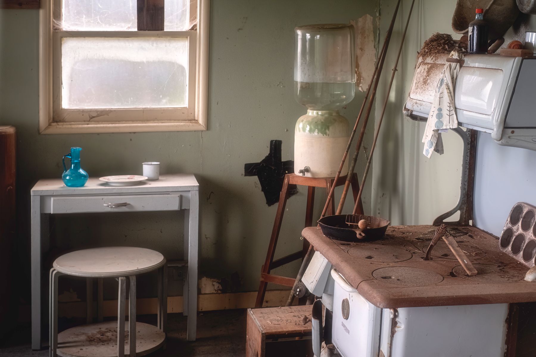 Vintage kitchen with an old stove and worn finishes